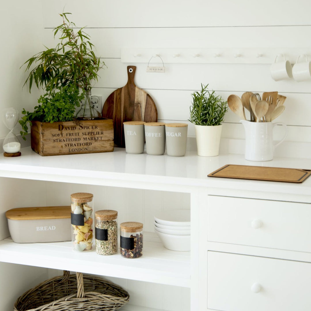 Naturally coloured kitchen with large round serving board