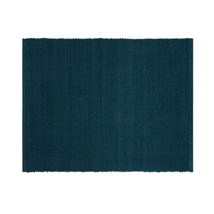 featuring a white polka dot pattern. Made from cotton and recycled cotton.
