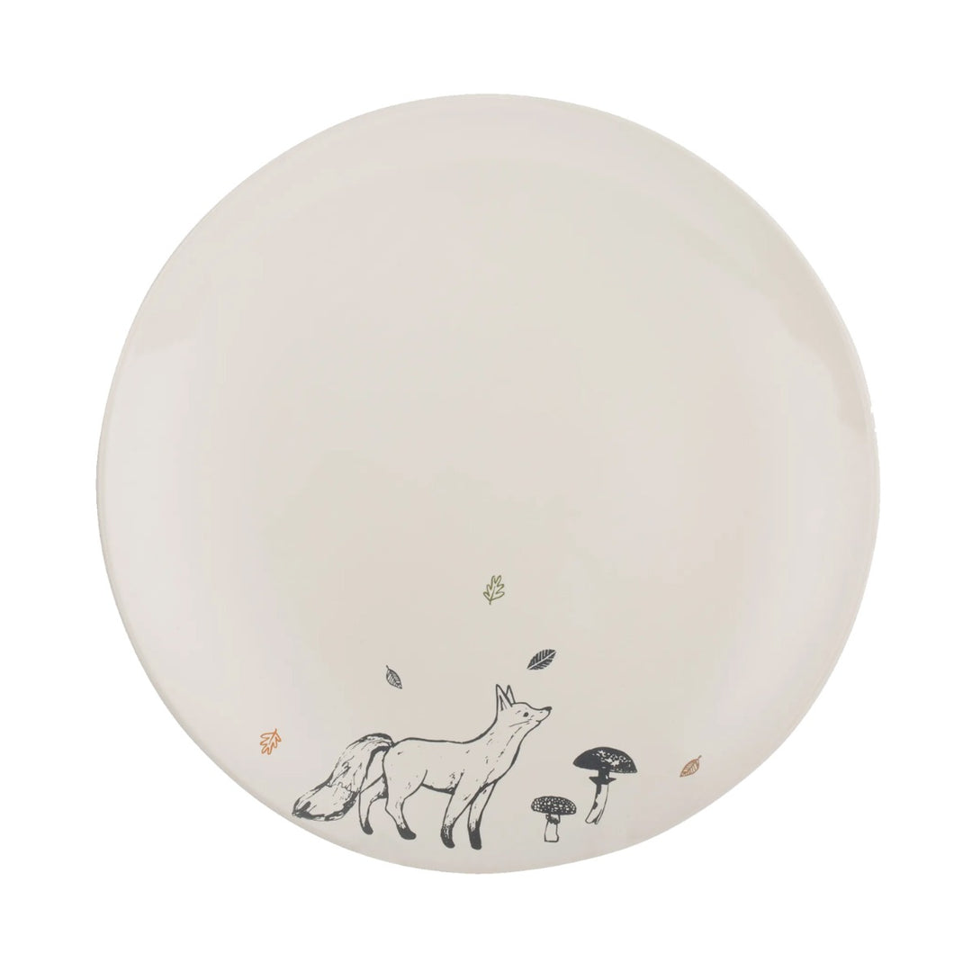 a cream stoneware dinner plate, with a navy blue fox decal