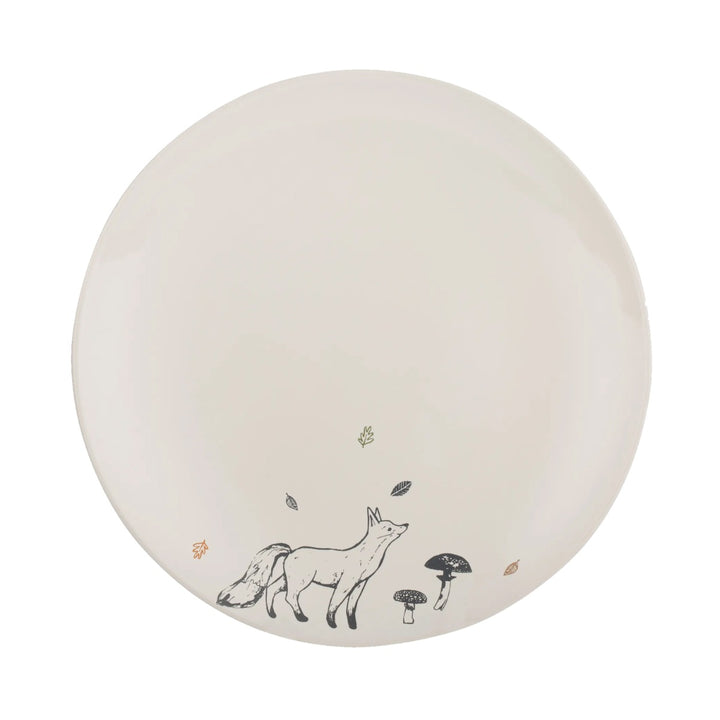 a cream stoneware dinner plate, with a navy blue fox decal
