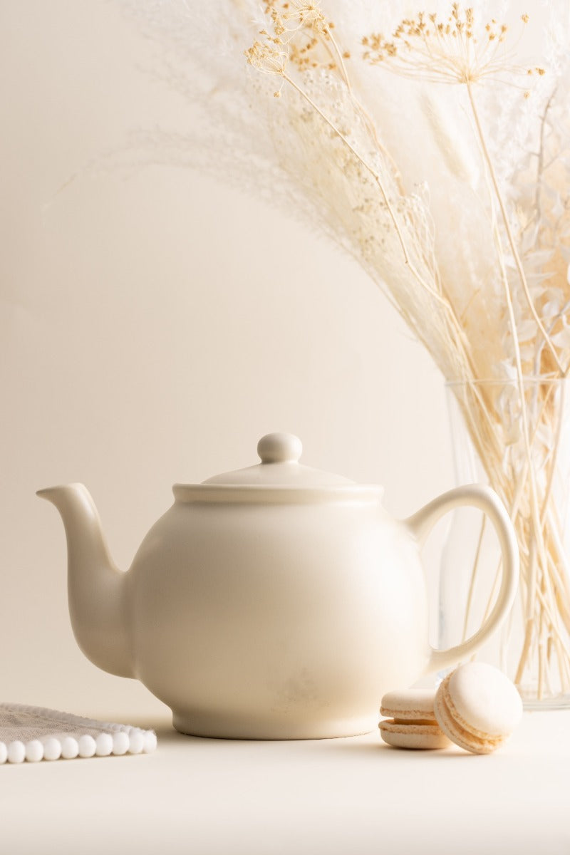 a Price & Kensington teapot pouring tea into a mug