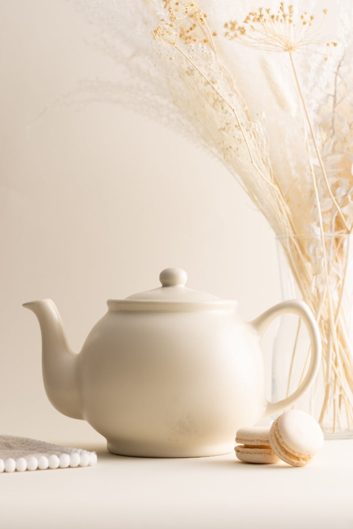 a Price & Kensington teapot pouring tea into a mug