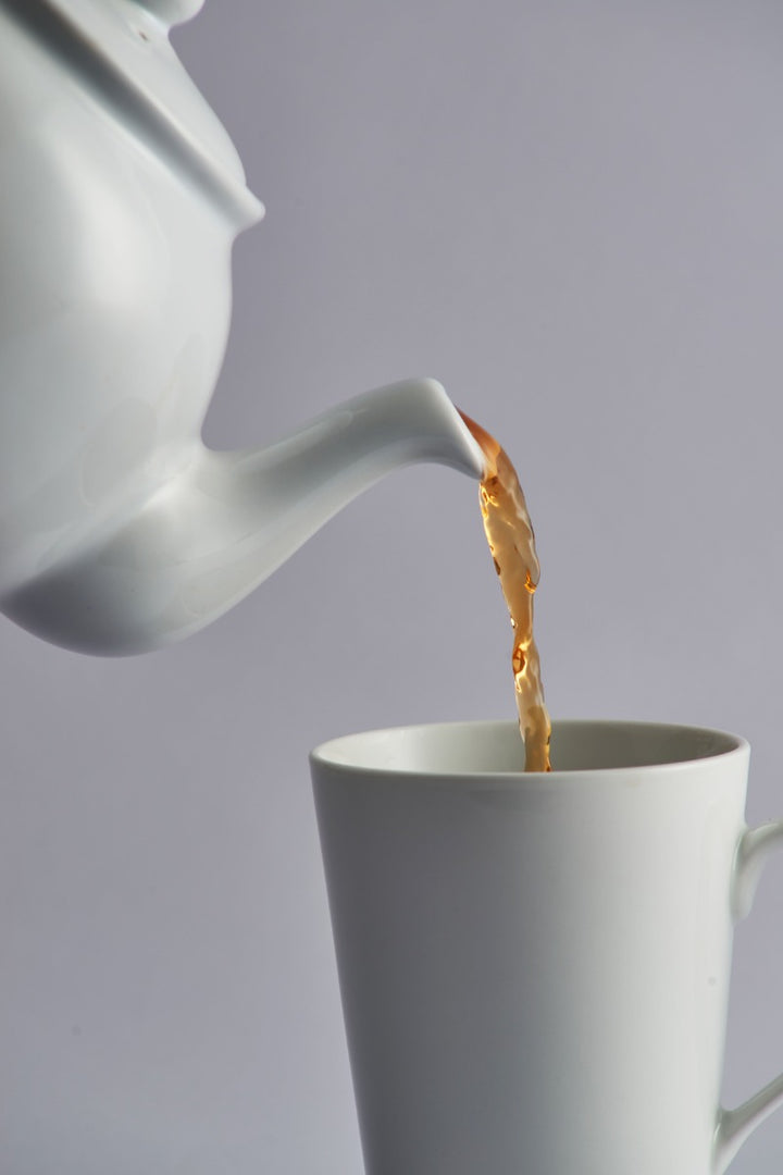large white teapot with a non-drip spout