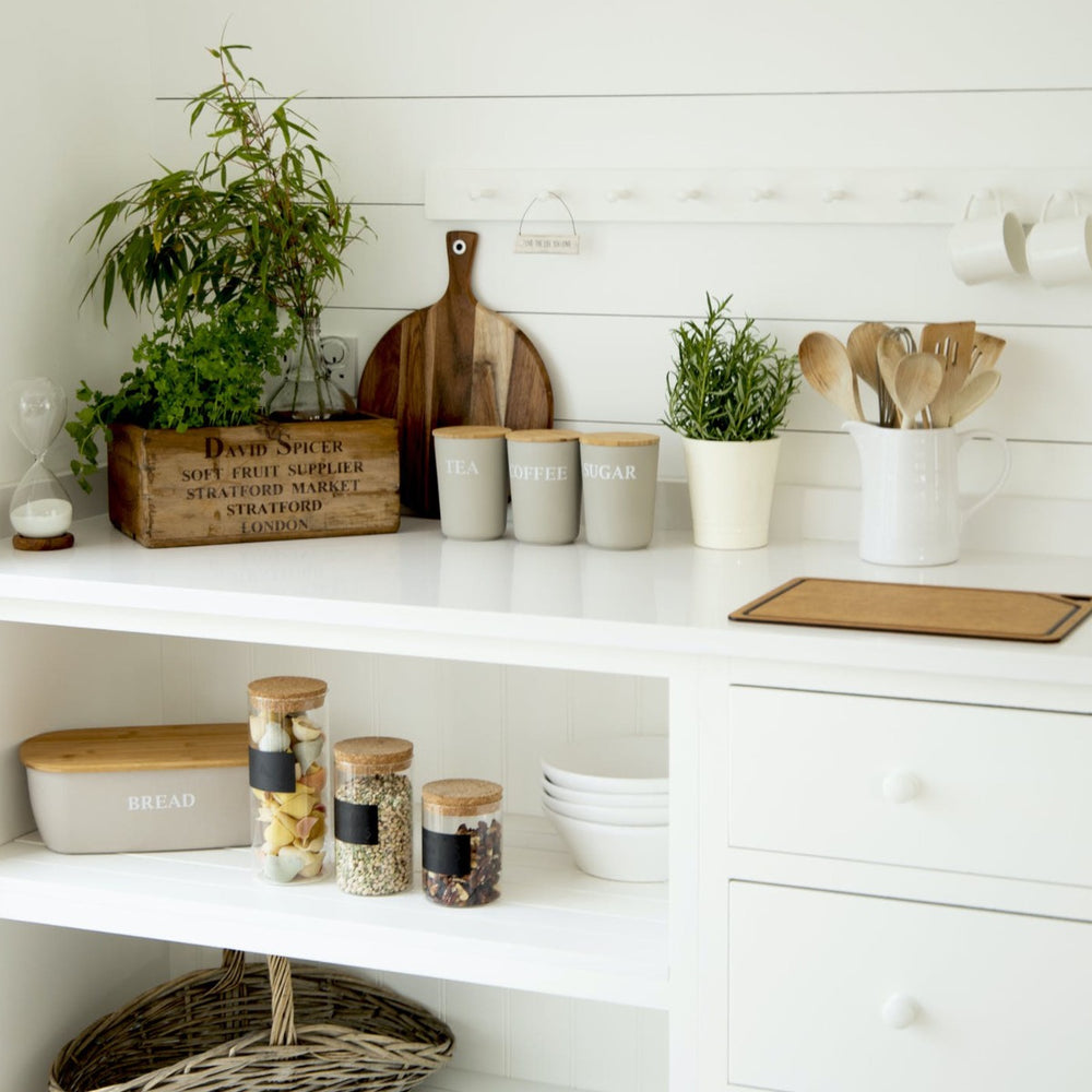 Naturally coloured kitchen with large round serving board