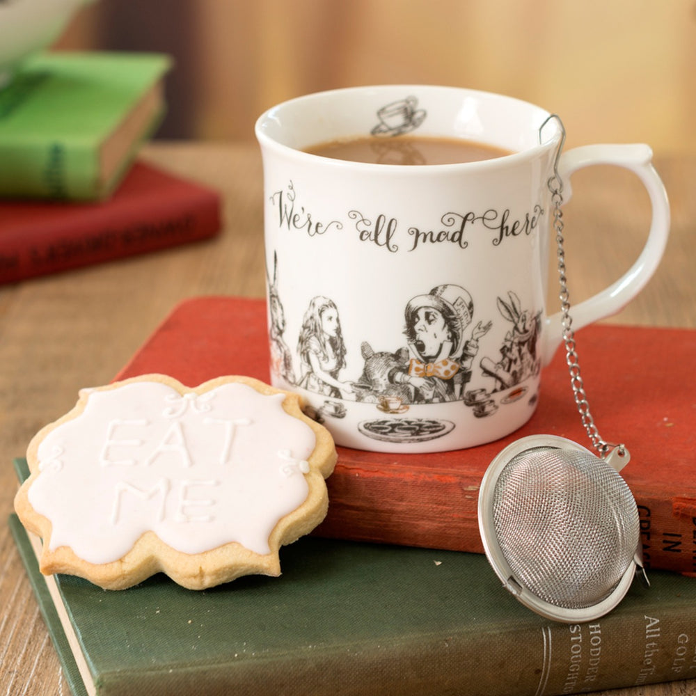 alice in wonderland themed mug with tea strainer