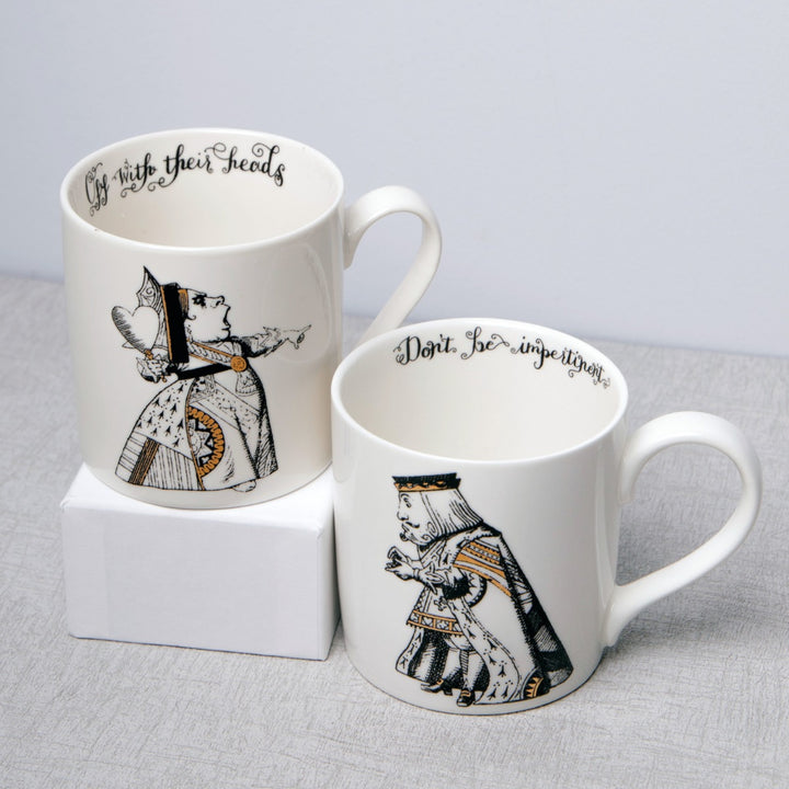 white china mugs with alice in wonderland illustrations