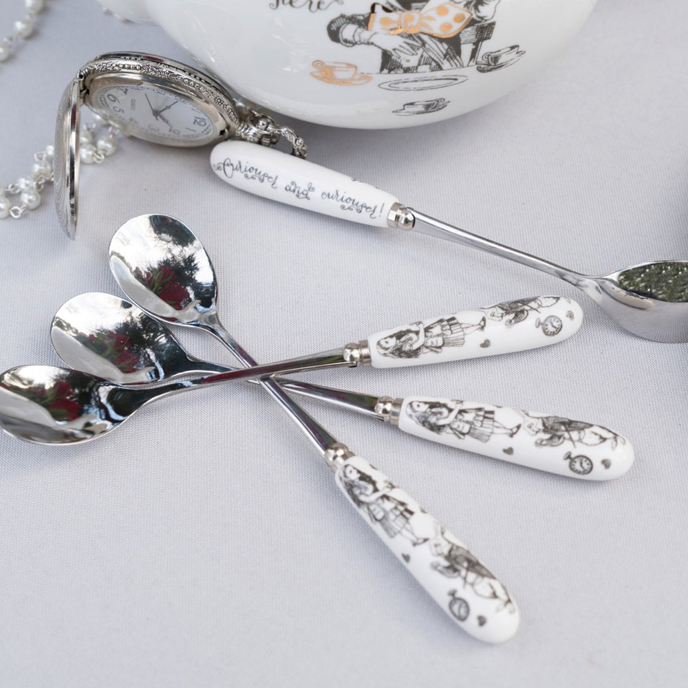 set of four spoons with alice in wonderland pictures