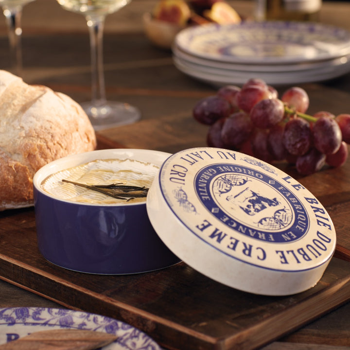 cheese baker with melted brie and grapes on tabletop