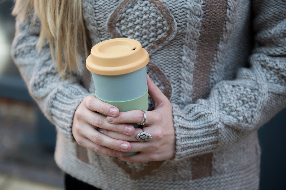  green and yellow travel mug for hot and cold drinks