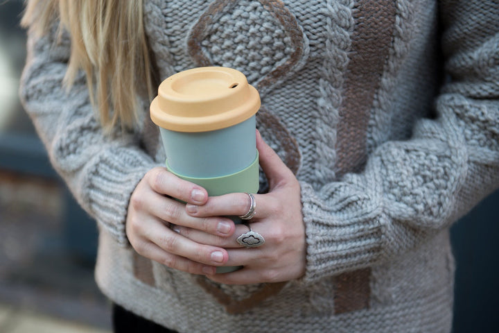  green and yellow travel mug for hot and cold drinks