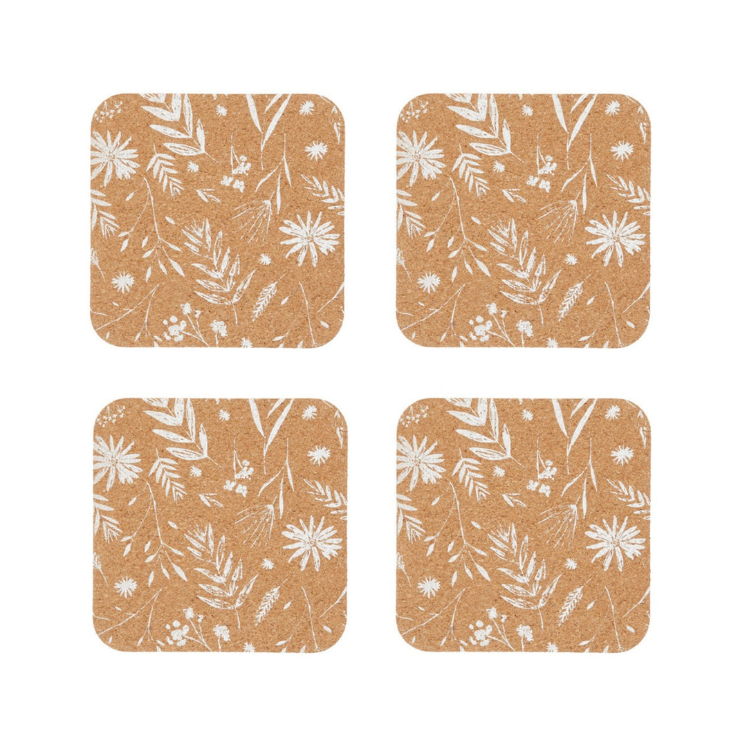 Set of four natural cork coasters featuring a white flowers print design.