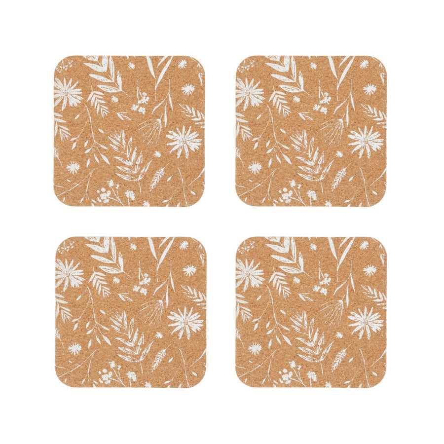 Set of four natural cork coasters featuring a white flowers print design.