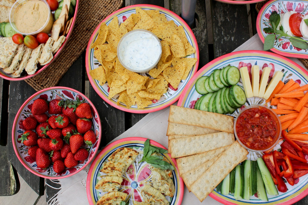 outdoor party food on mediterranean inspired dinnerware