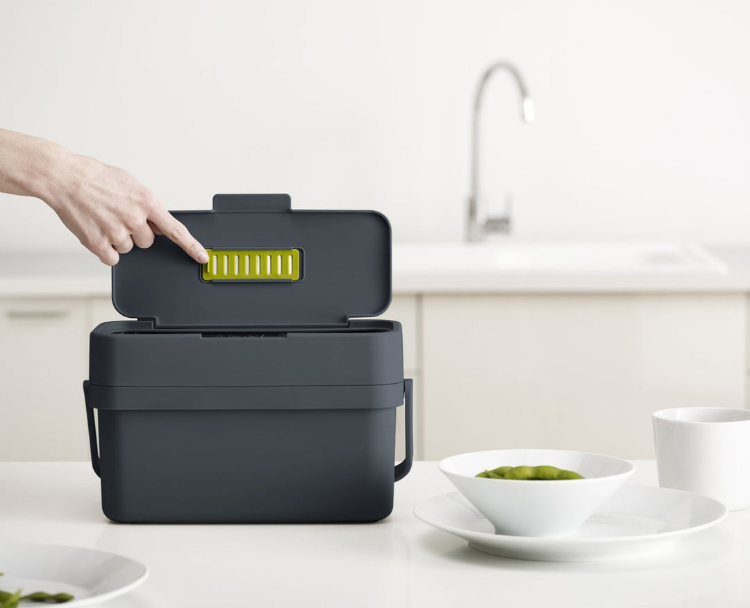 Grey food caddy with filter storage