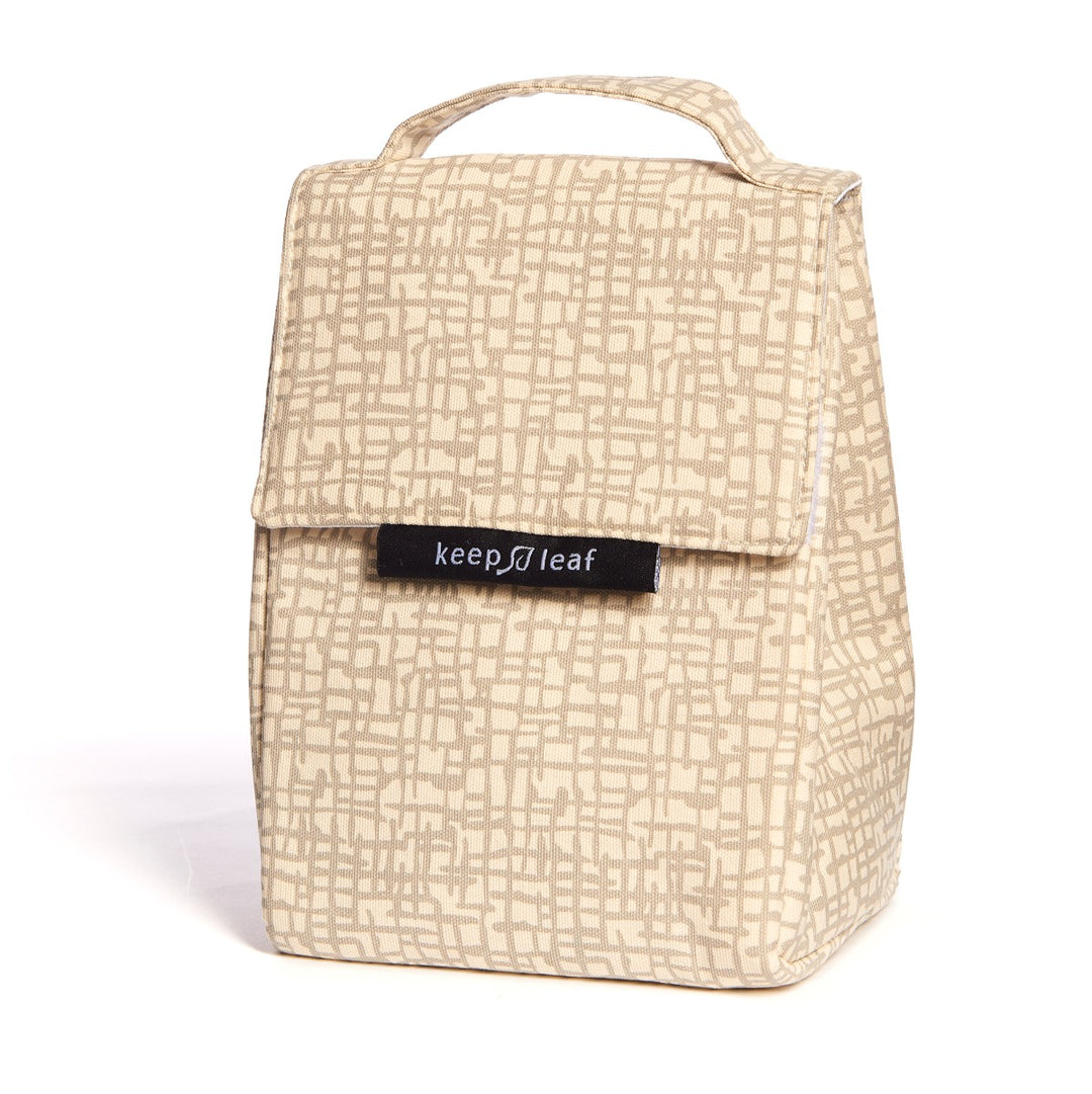 Beige mesh like printed lunch bag, with top carrying handle, ideal for schools and workplaces alike