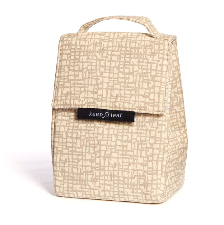 Beige mesh like printed lunch bag, with top carrying handle, ideal for schools and workplaces alike
