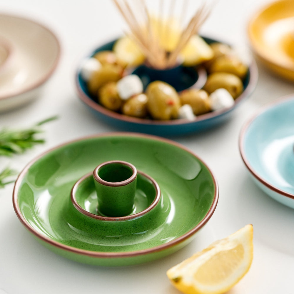  finished in green glaze with an integrated pip well and stick holder
