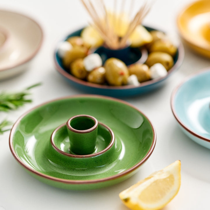  finished in green glaze with an integrated pip well and stick holder