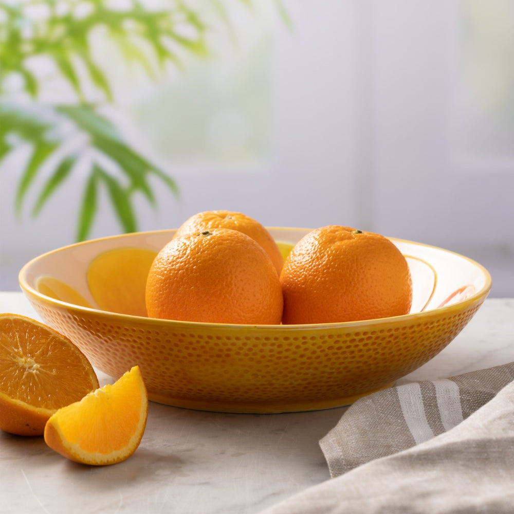  made from ceramic and finished in orange glaze