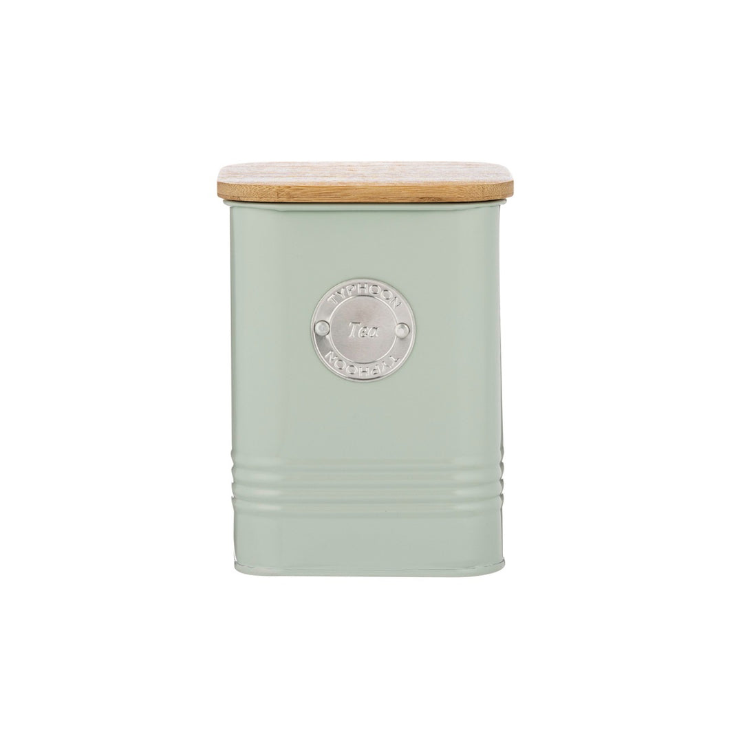a mint green metal tea storage canister with a bamboo lid