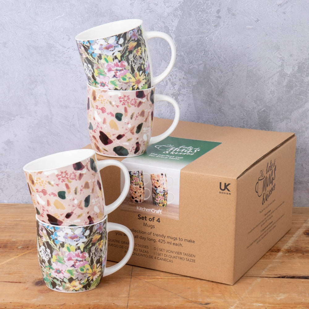 set of four porcelain drinking mugs for tea and coffee