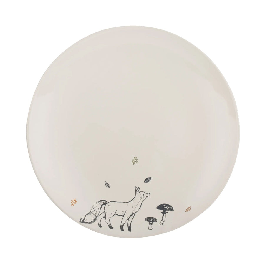 a cream stoneware dinner plate, with a navy blue fox decal