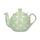 a traditionally shaped round teapot finished in peppermint green with white polka dots