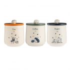 Set of three ceramic canisters featuring woodland themed designs with different coloured lids and text detailing of tea, coffee and sugar.